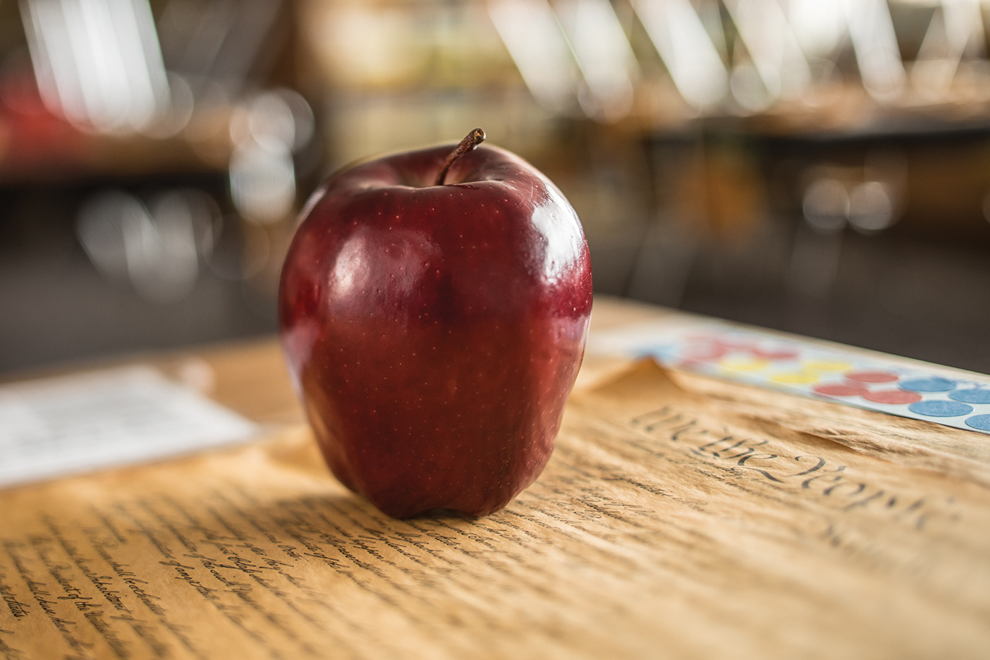 An apple sitting on the Declaration of Independence.