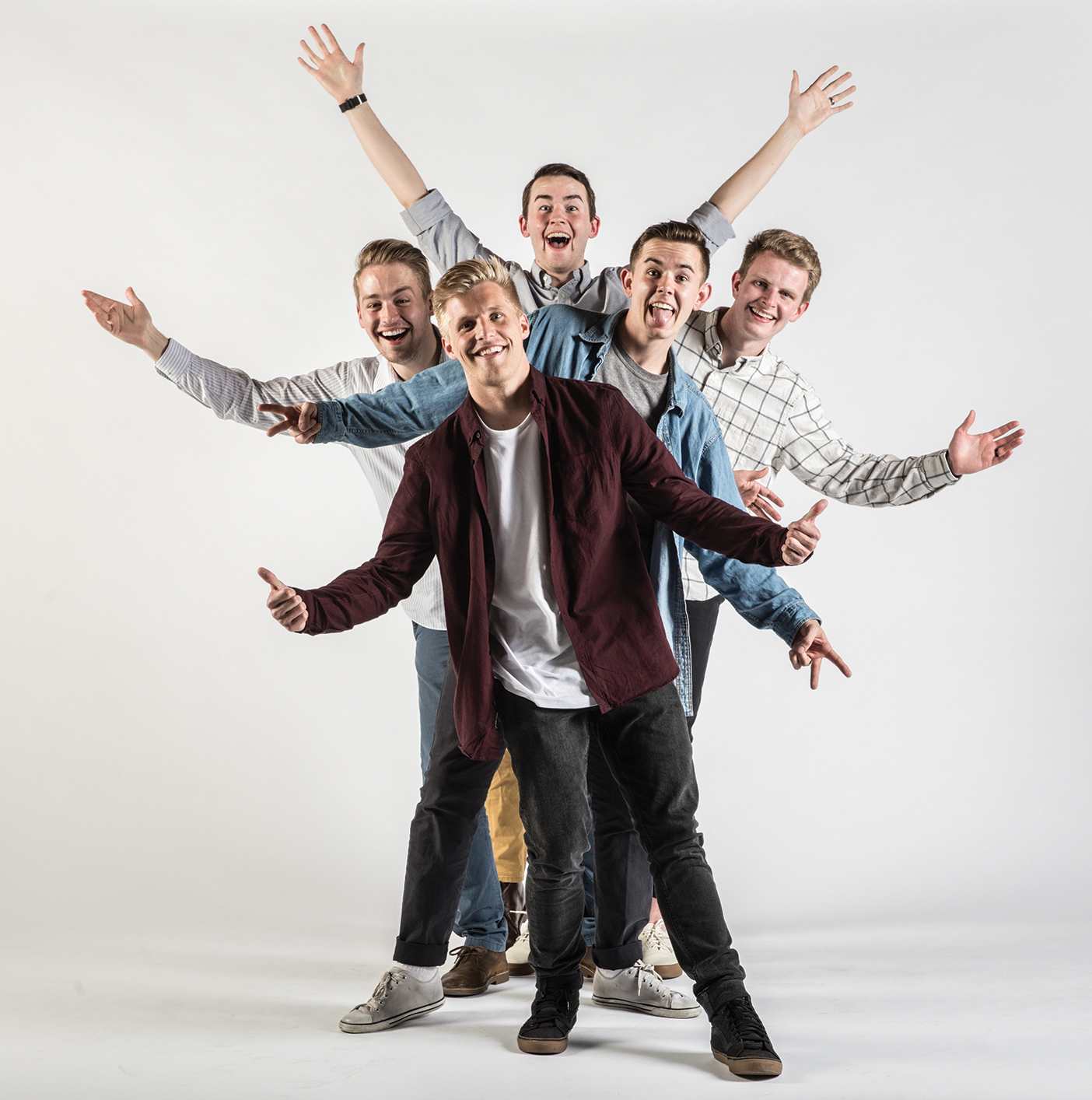 Members of the Hey Joe Show, Connor Peck, Sumner Mahaffey, Tylan Glines, Jacob Mingus, and Davis Blount, standing behind each other with their arms out.