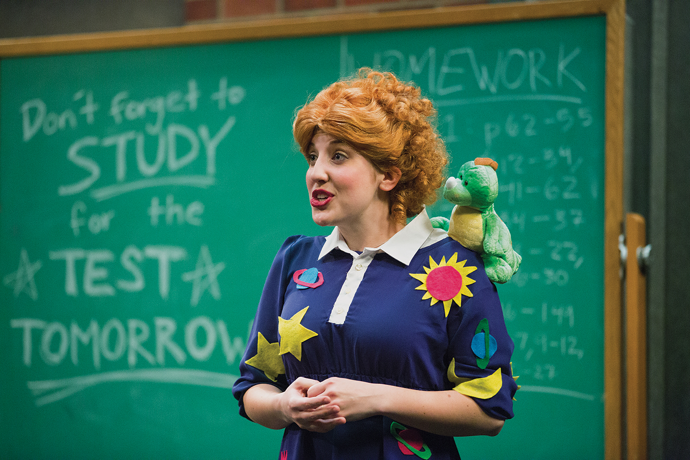 a cast member dressed as Mrs. Frizzle from The Magic School Bus