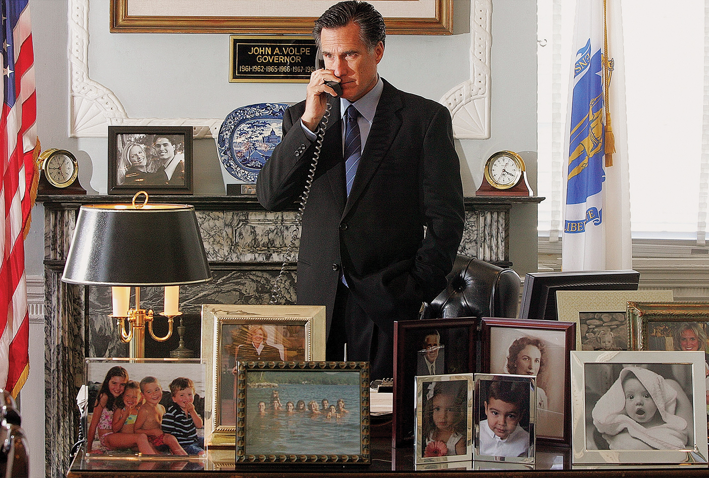 Romney talks on the phone as he stands behind his desk during his presidential campaign.