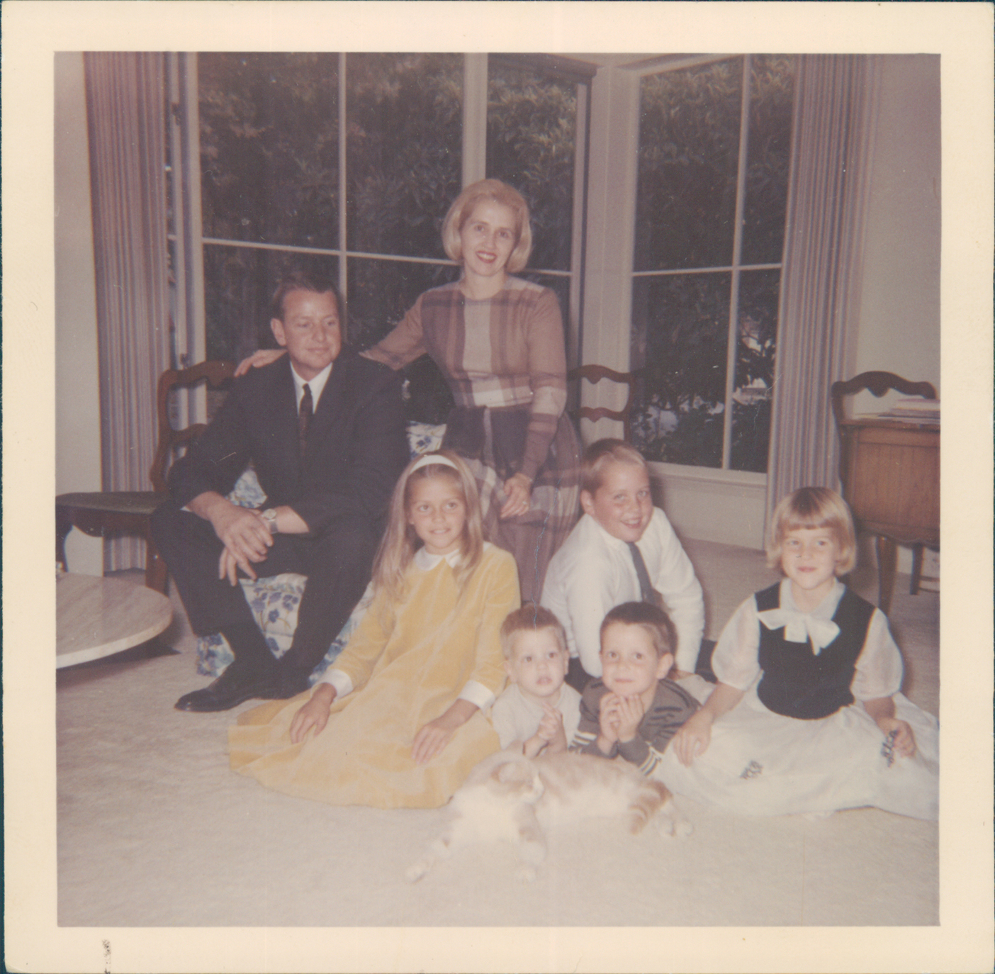 The young Wheatley family poses with their four kids and a cat.