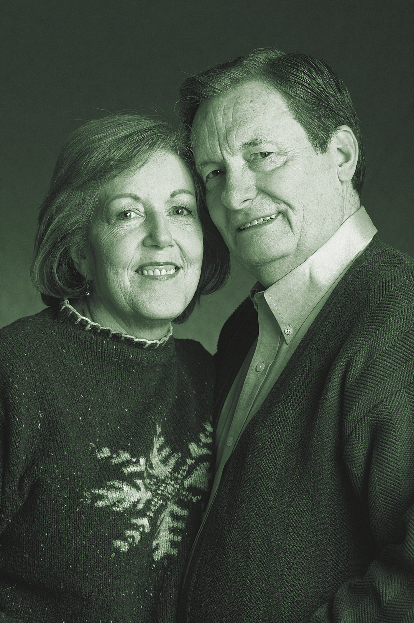 An older couple poses for a portrait