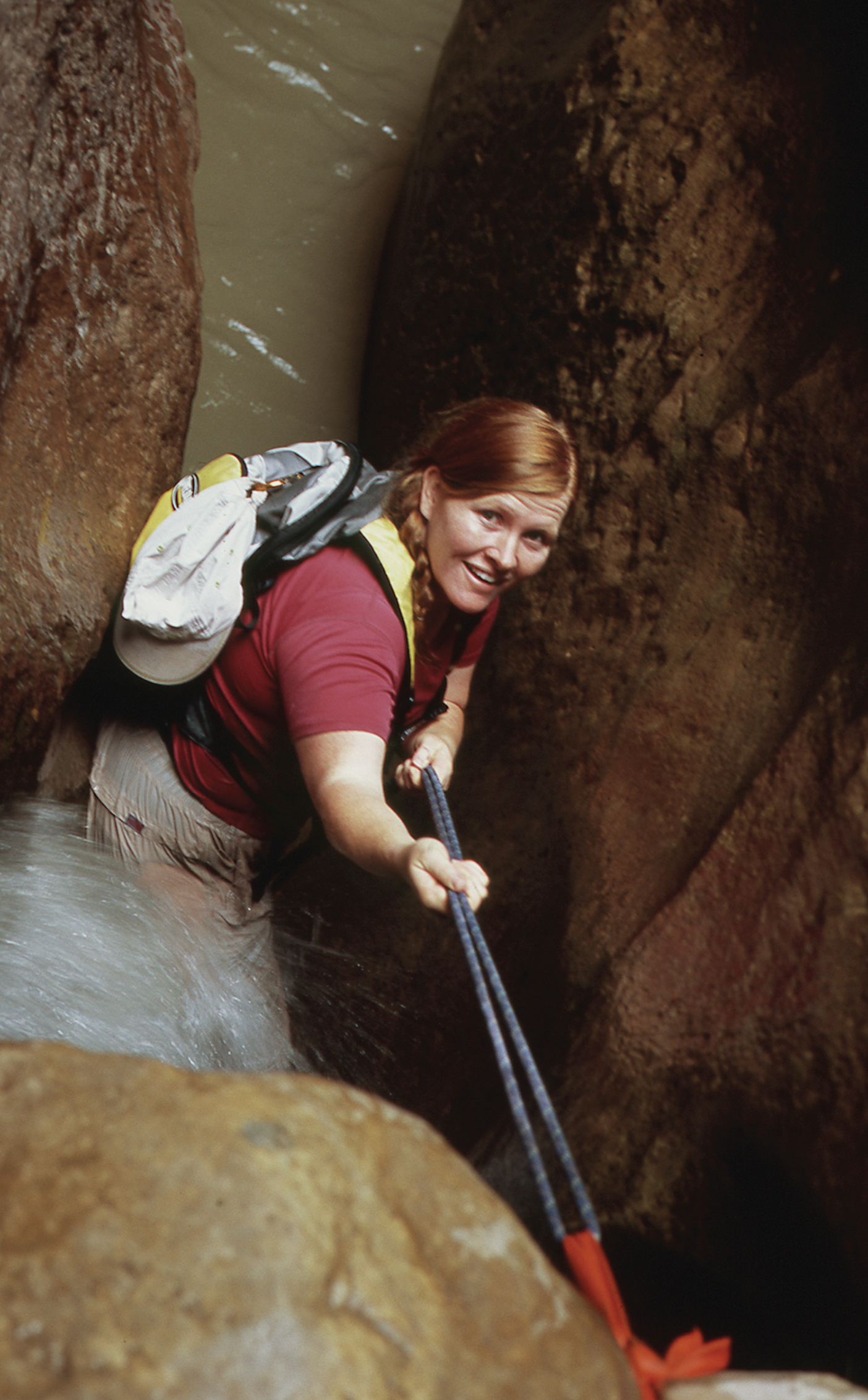 Katie Steed descends down into a slot canyon