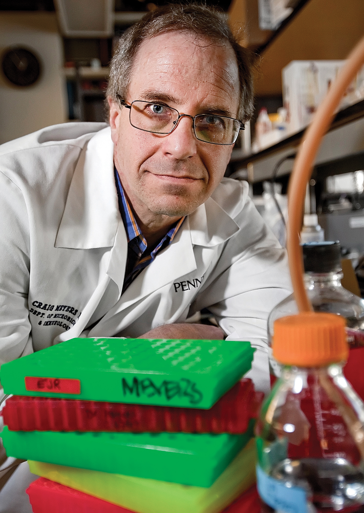 Meyers stands behind containers of the AAV2 virus.