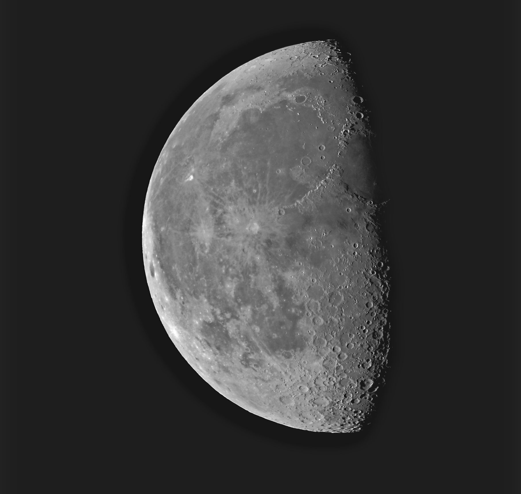 A photo of the moon. The moon is half shaded in darkness.