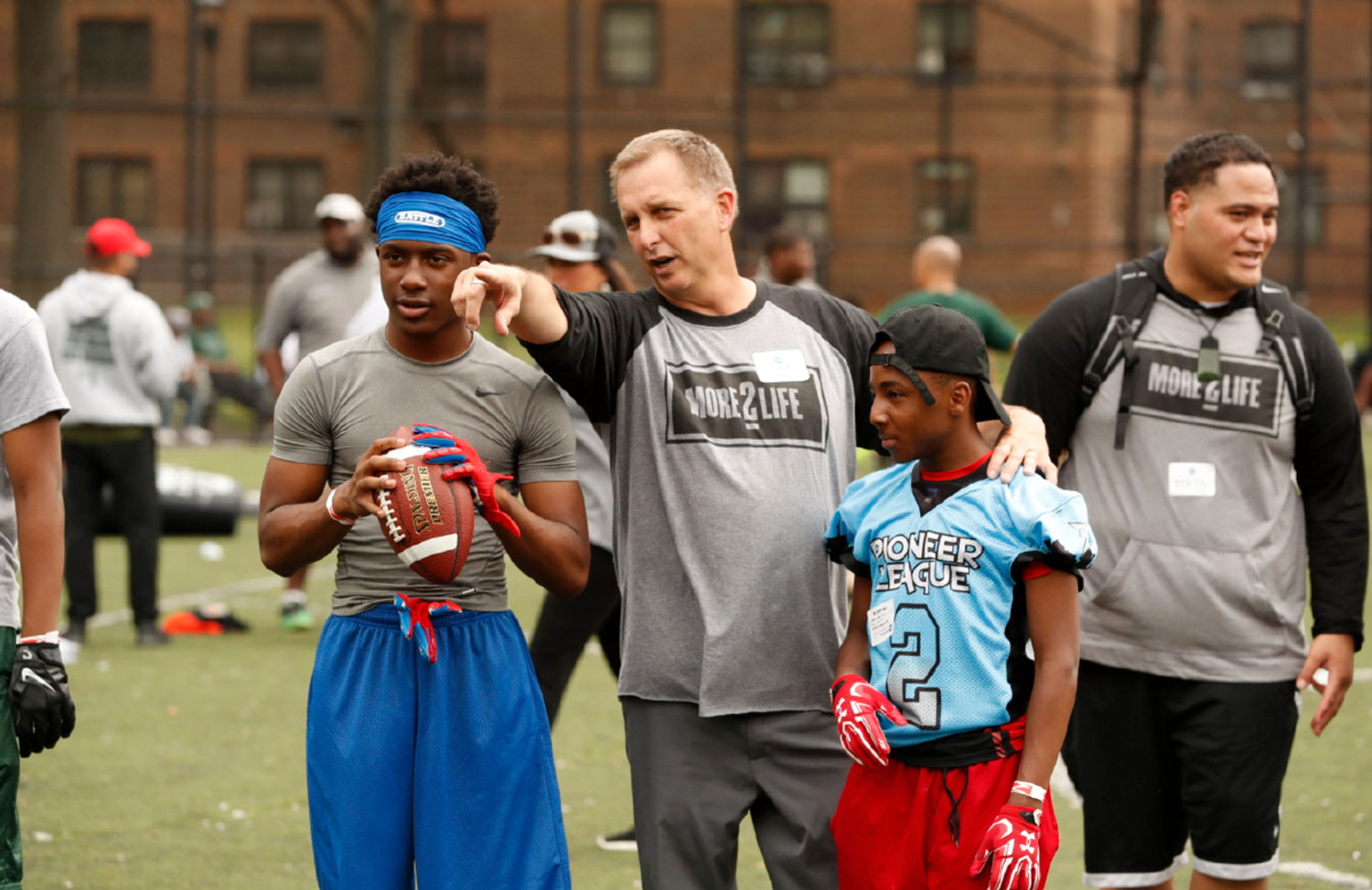 BYU coach Ty Detmer works with QBs at the camp.