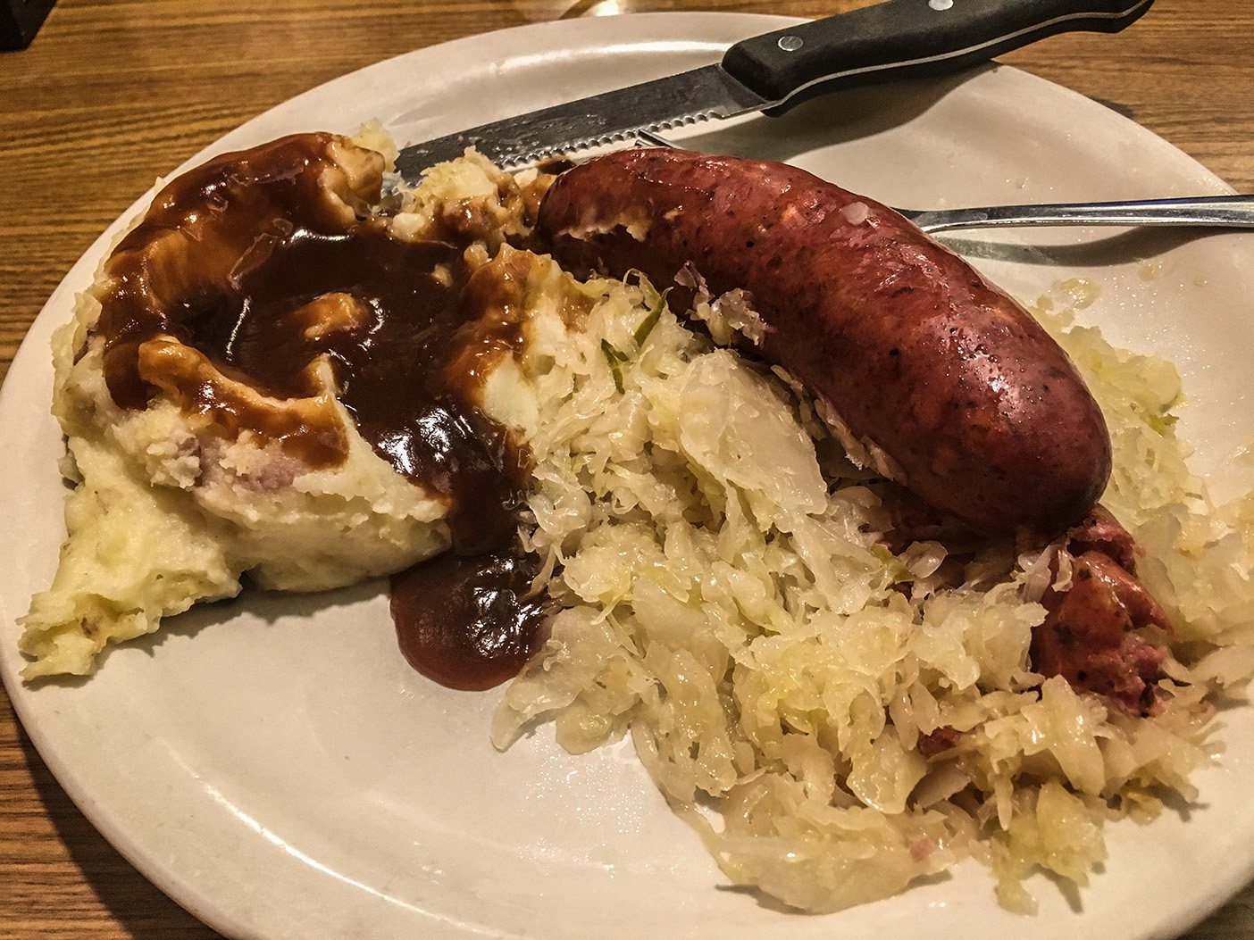 A bratwurst, sauerkraut, and potatoes birthday dinner.