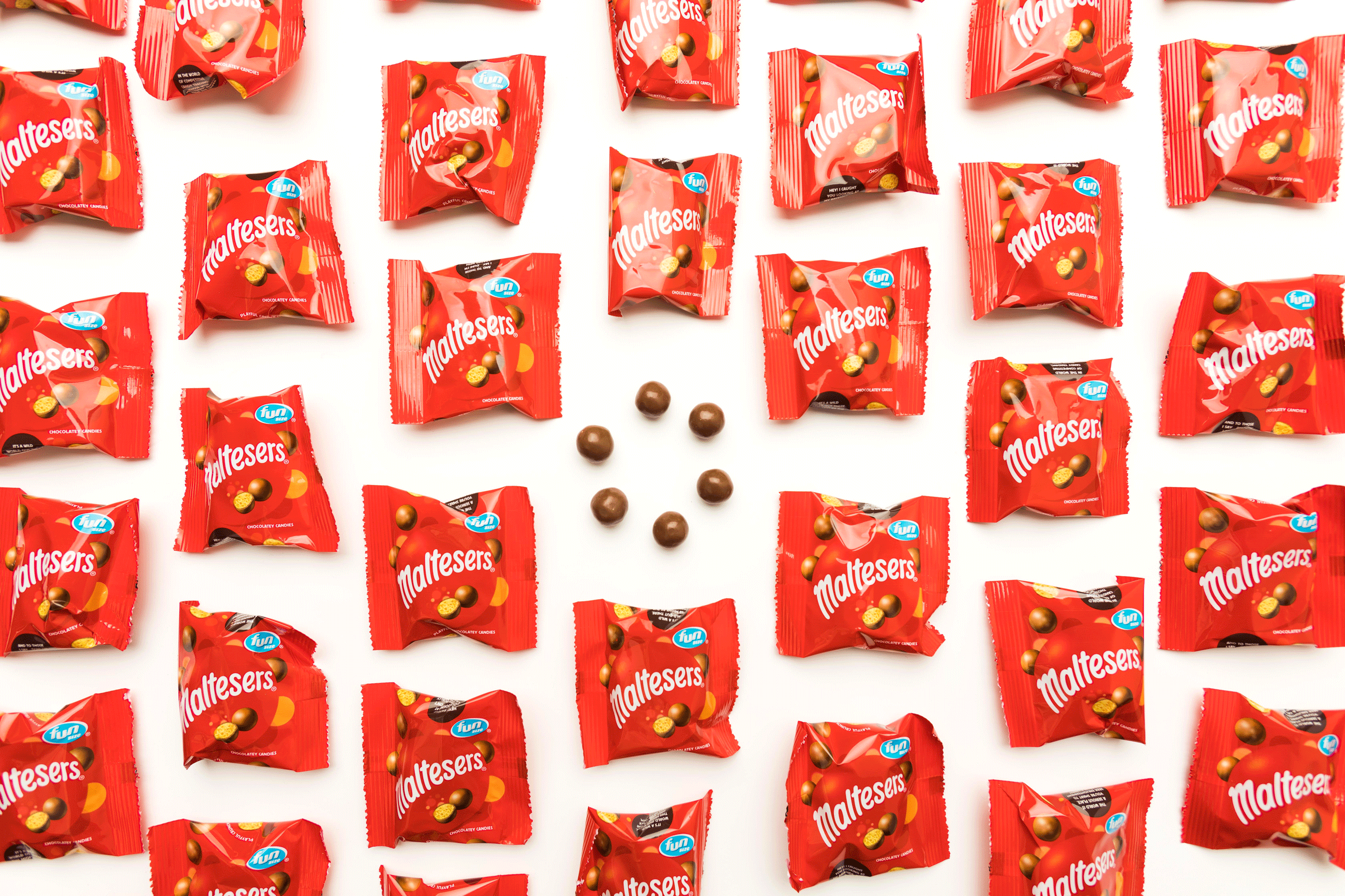 An artistic arrangement of packs of Maltesers.