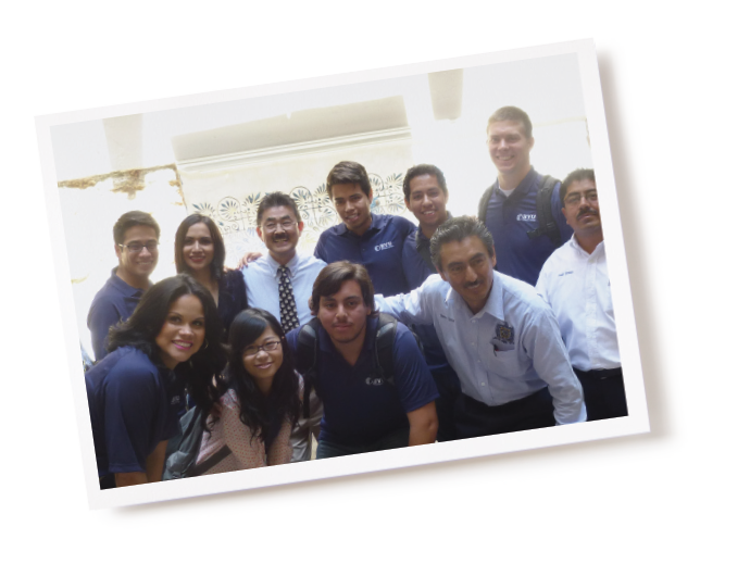 A group of BYU students and MExican business people pose for a picture