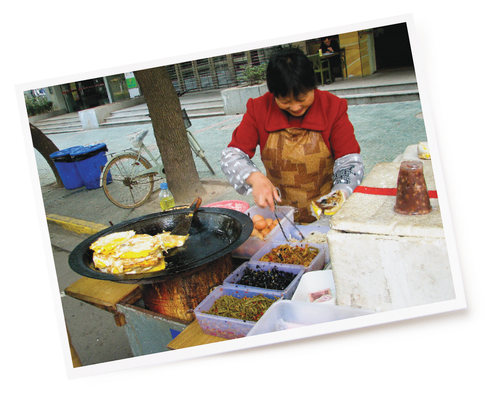 a street vendor preparing omelettes