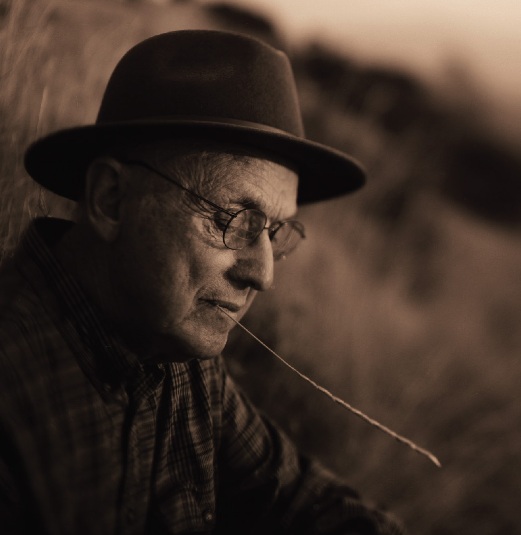 Doug Thayer poses with a piece of grass in his mouth.