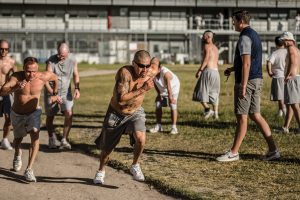 Inmates at the Utah State Prison run on a dirt track in the prison yard.
