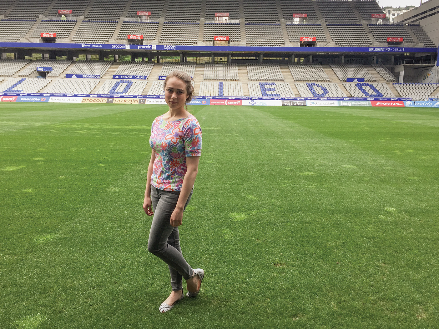 Mallory Stack poses on the field of the Real Oviedo soccer stadium