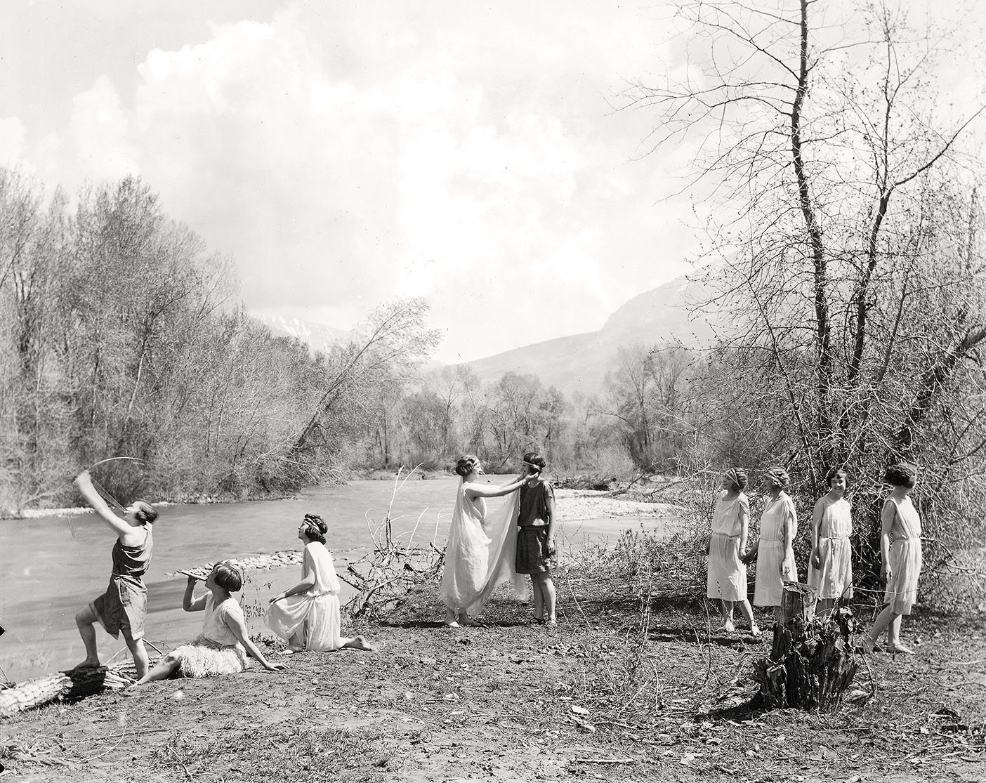 Women in a 1923 BYU women's physical education class perfrom the dance drama Aphrodite and Adonis on the banks of the Provo River.
