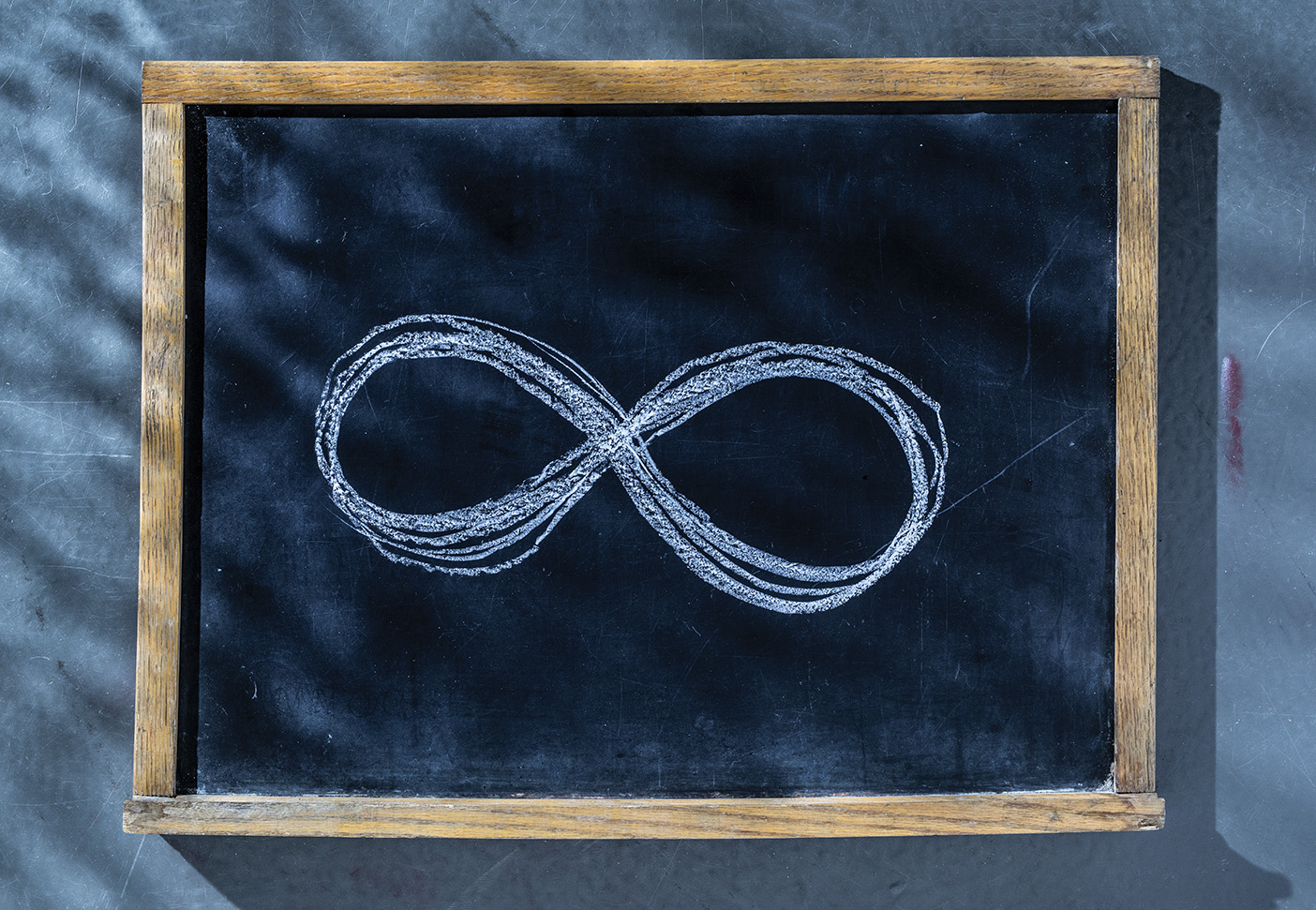 Chalkboard drawing of the symbol for infinity.