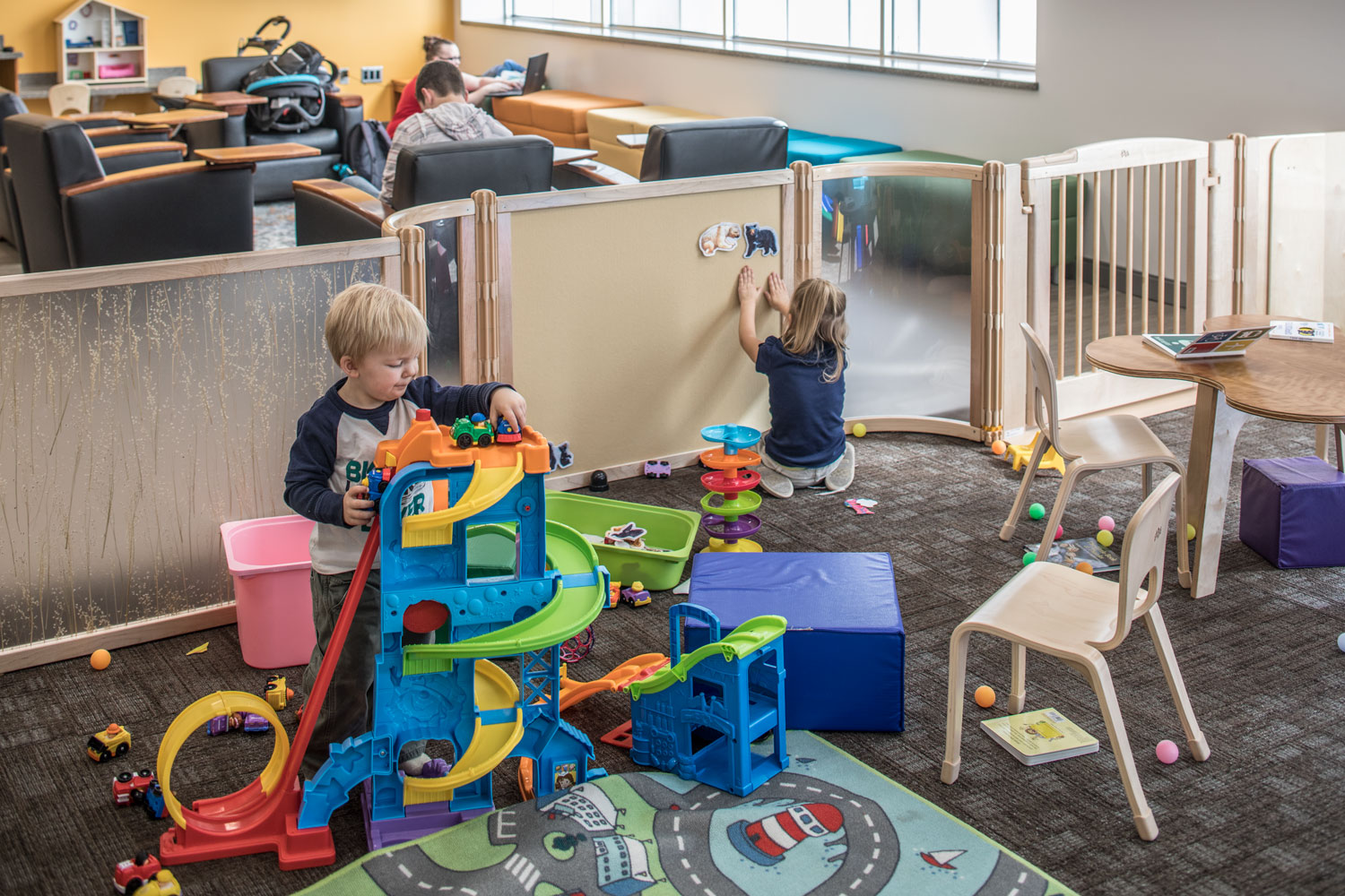 Kids play with toys in BYU's new family study room