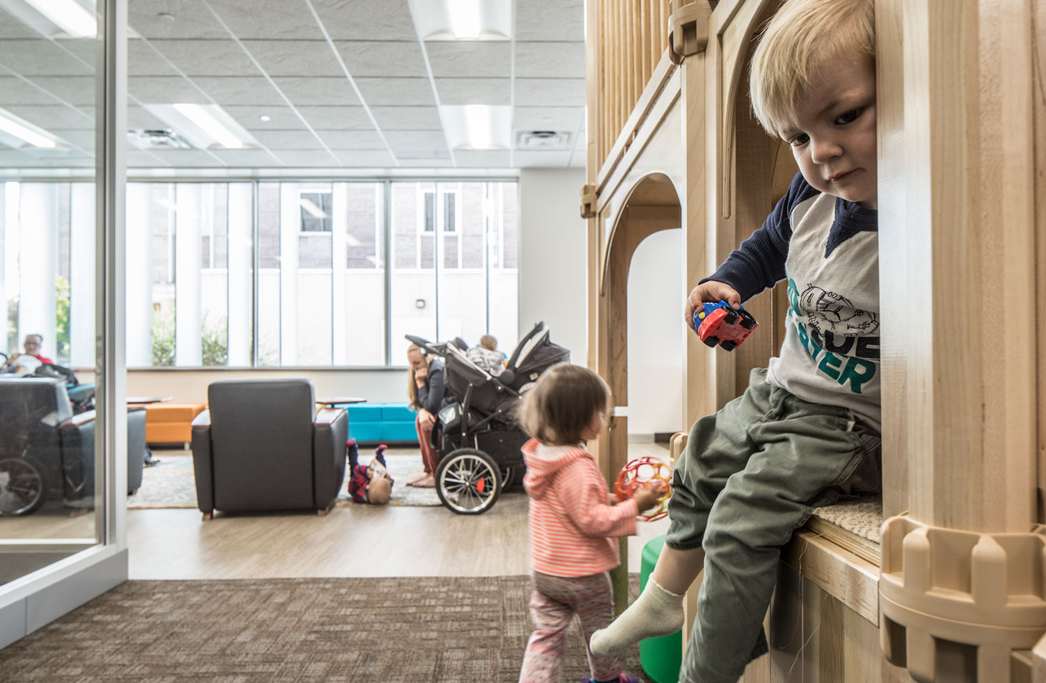 Children on the play structure in BYU's new family study room
