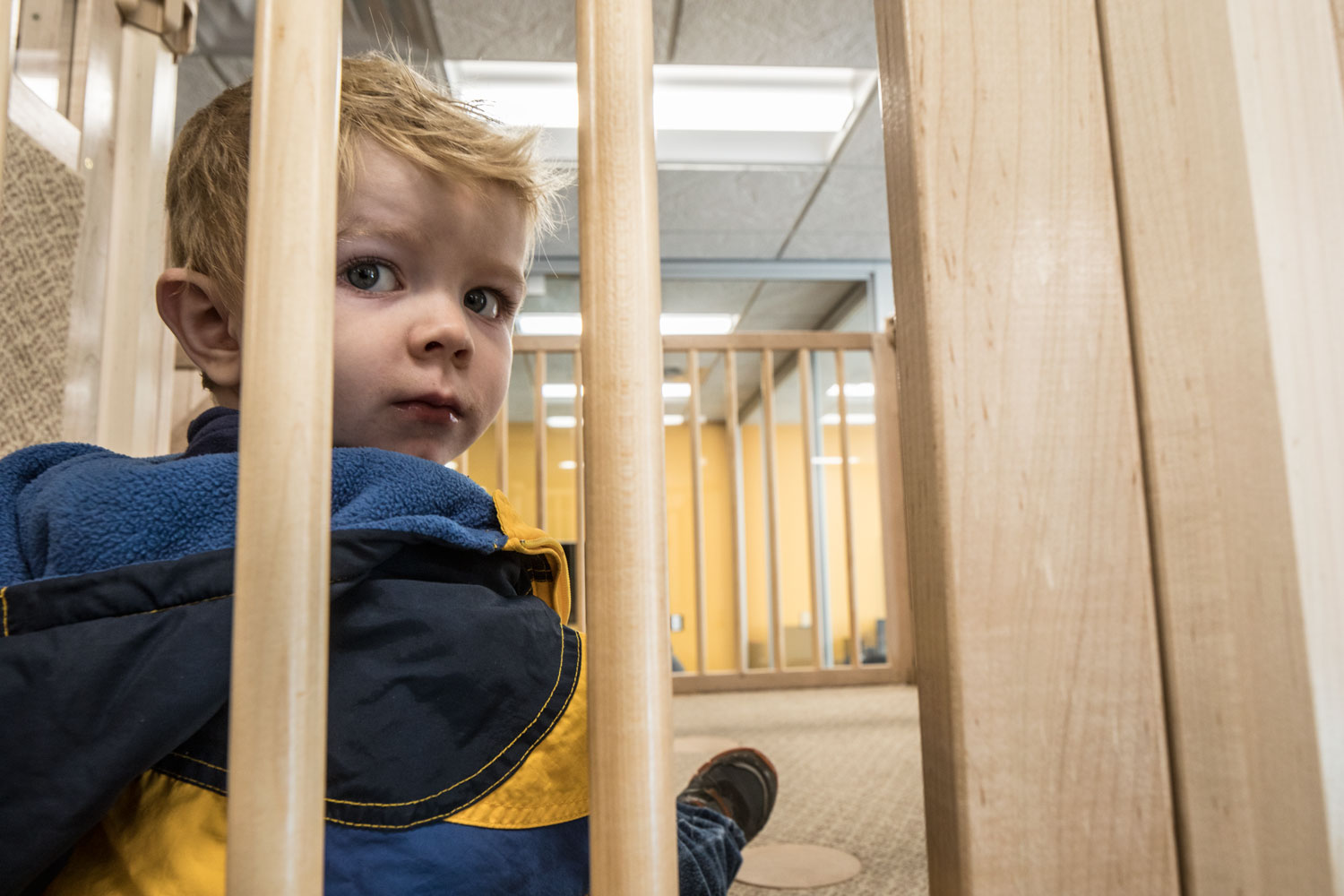 A child sits up on the play structure in the new family study room