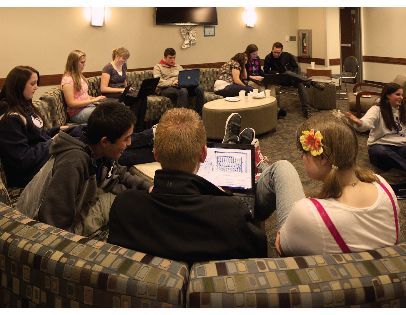 A group of students study in the common room.