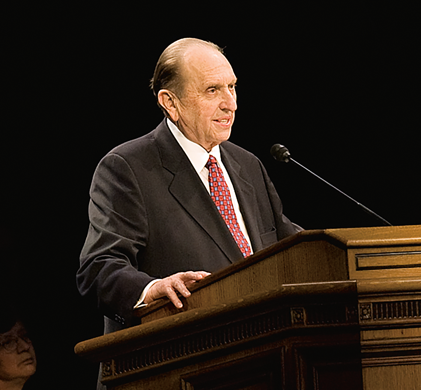 A photo of President Thomas S. Monson at the devotional pulpit.