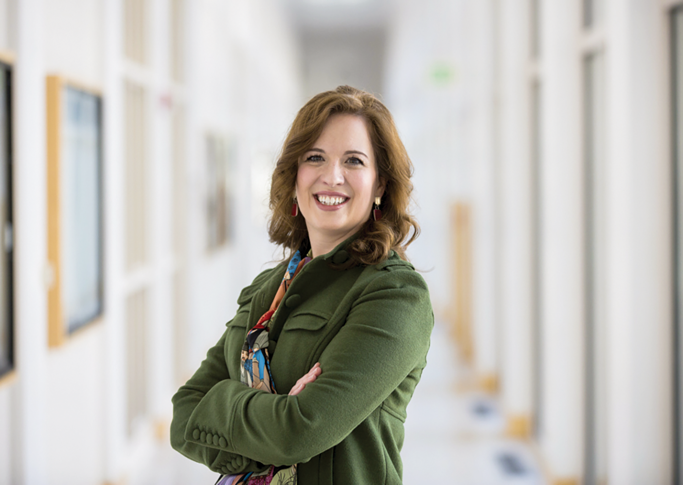 Photo of Erin Holmes standing in the hallway of the Joseph Fielding Smith building.