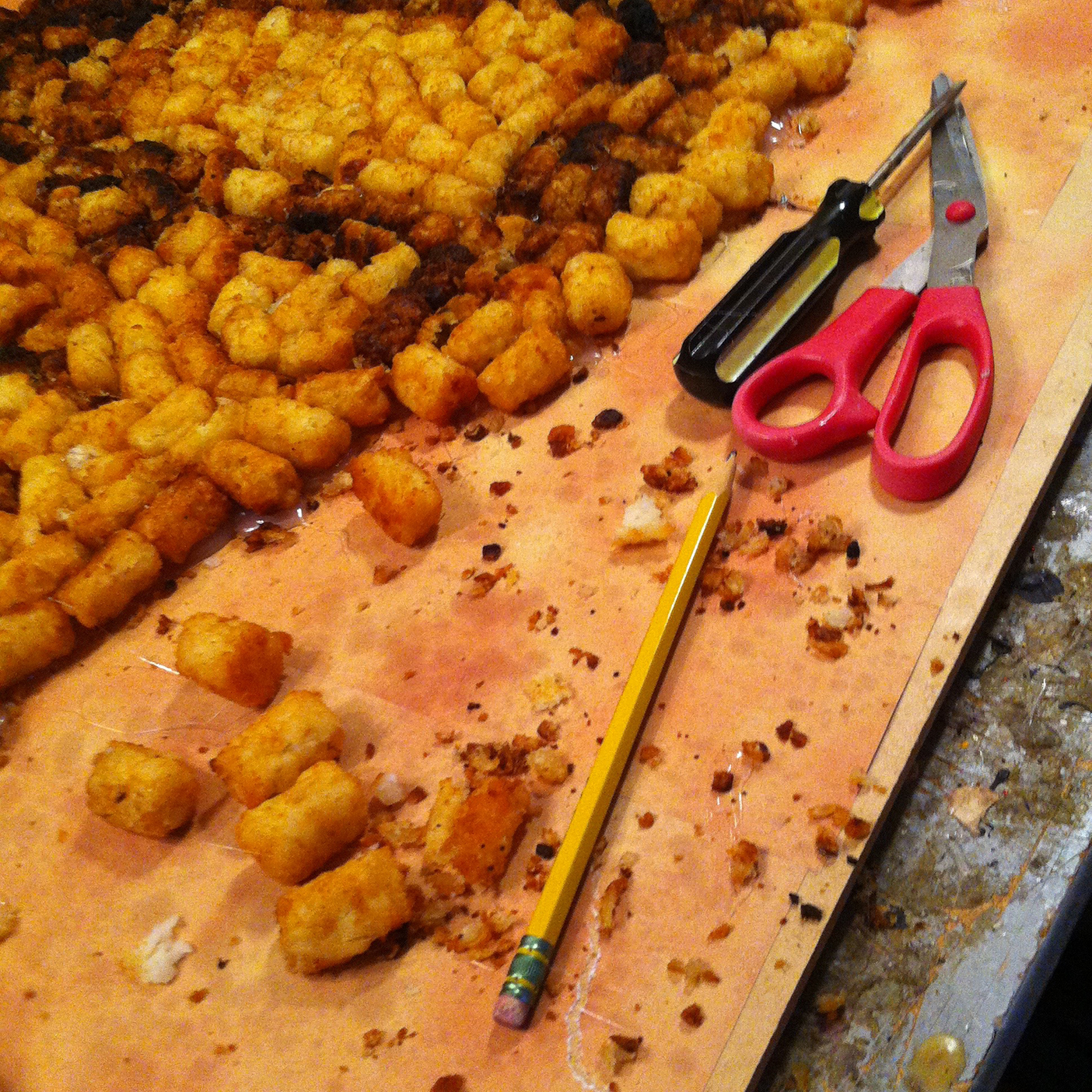 Photo from the process of making the cover art showing Napoleon Dynamite made out of tater tots