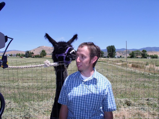 The Hess family llama, aka Tina, and cinematographer Munn Powell.