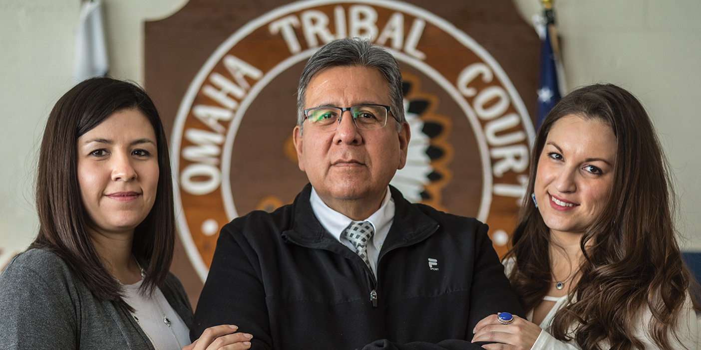 Ed Zendejas, the chief judge on the Omaha Reservation, stands flanked by his daughters Brooktynn Zendejas Blood (left) and Jordan Zendejas, also judges.