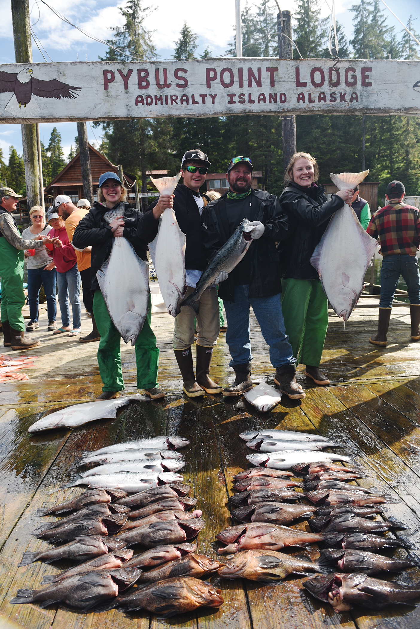 BYU students and their boat captain (second from right) show off their catch.