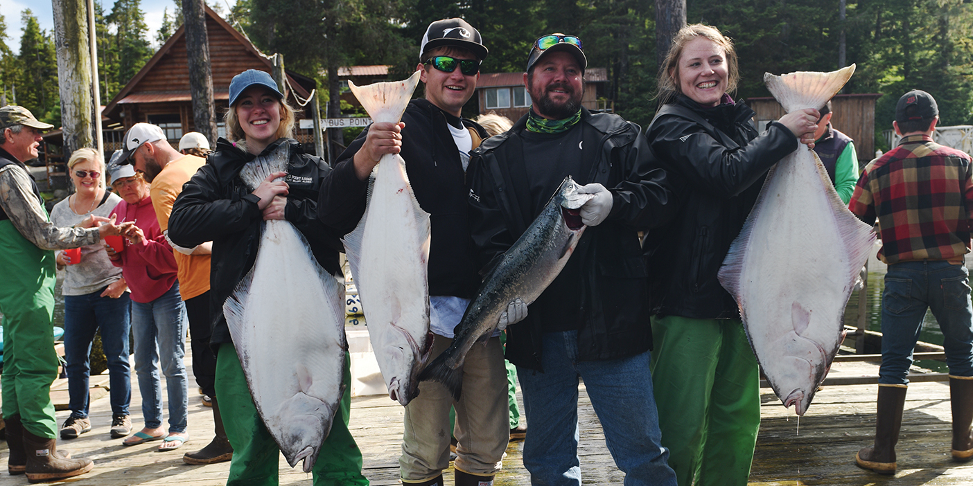 BYU students and their boat captain (second from right) show off their catch.