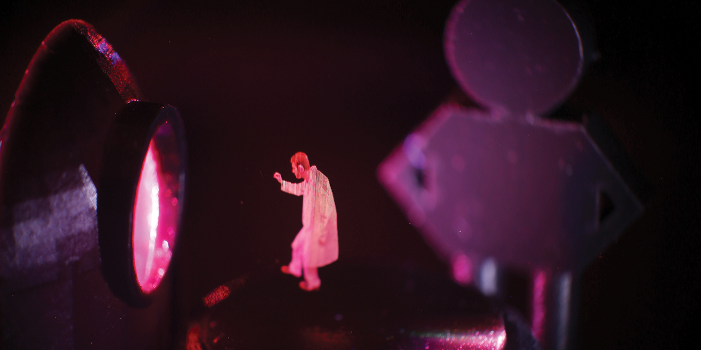 A volumetric display image of a student wearing a lab coat.