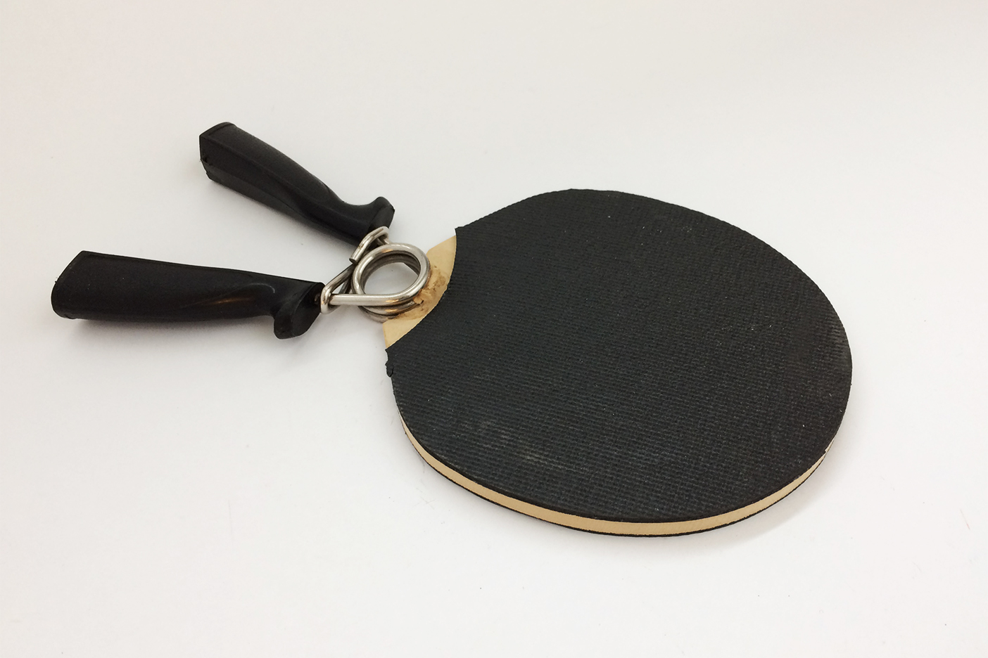 Photo of a two-handle ping pong paddle.