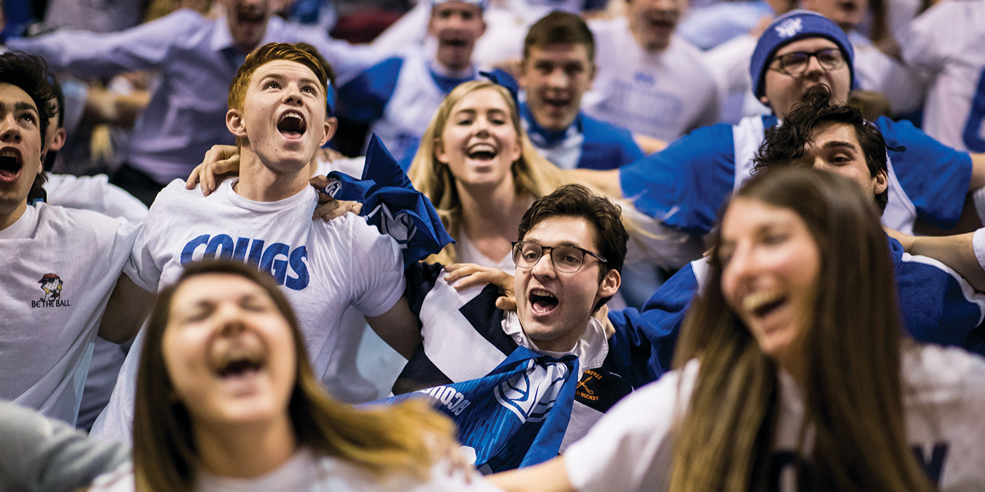 Photo of BYU students cheering in the ROC section.