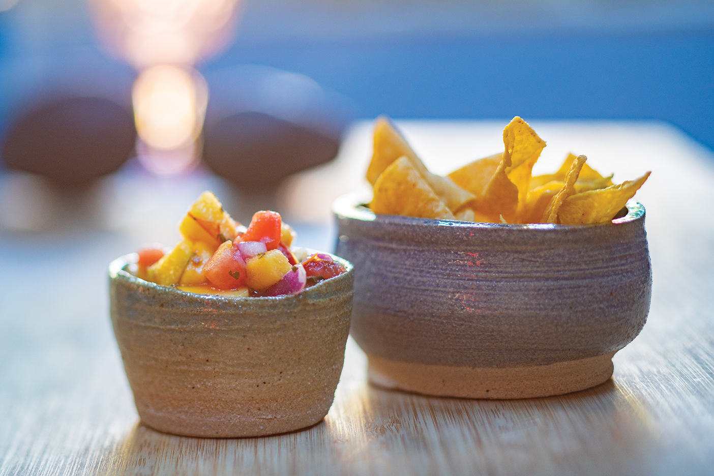 A photo of a bowl of chips and salsa.