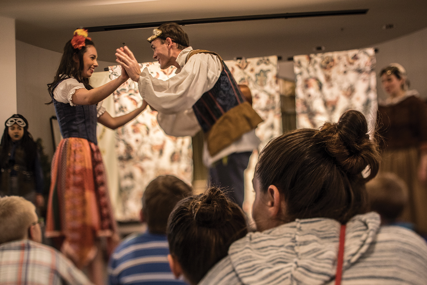 A young woman and young man portray the parts of Romeo and Julieta in the bilingual play.