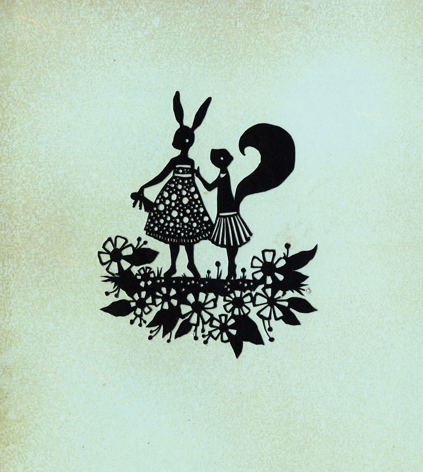 A papercut art piece depicting a rabbit and squirrel
