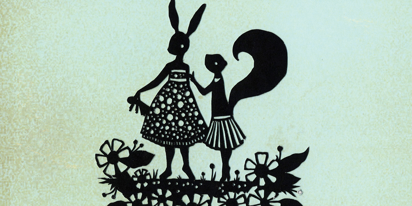A papercut art piece depicting a rabbit and squirrel