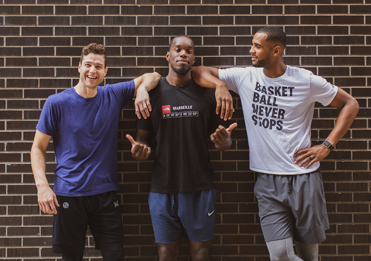 Former BYU basketball stars Jimmer Fredette, Charles Abouo, and Brandon Davies