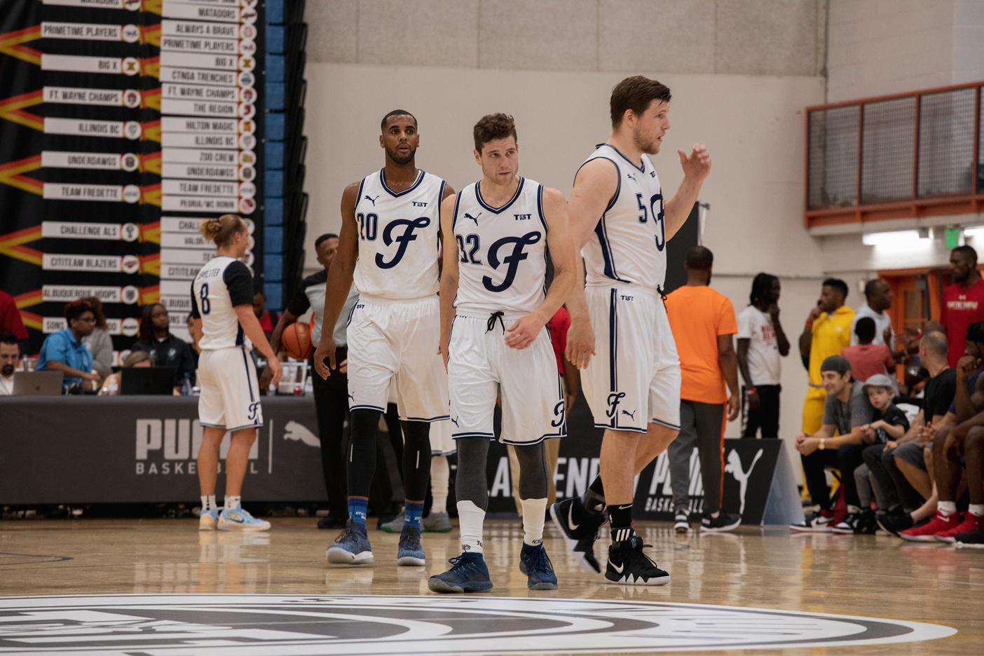 Jimmer Fredette and Brandon Davies on the basketball court of during the 2018 The Basketball Tournament