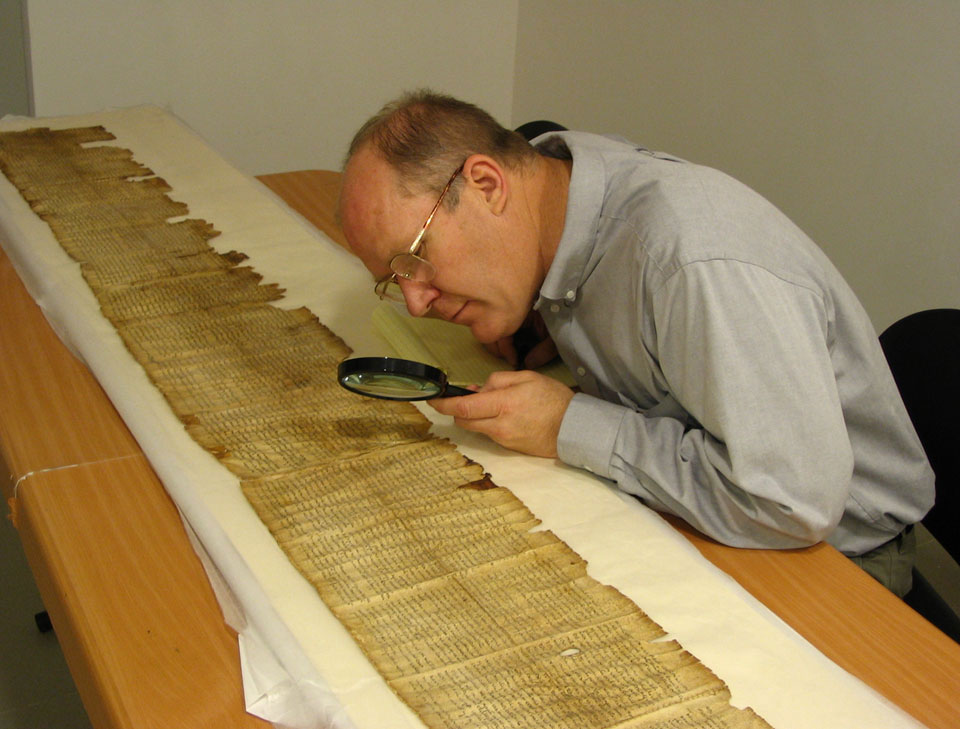 BYU professor Donald Parry pores over ancient scrolls.