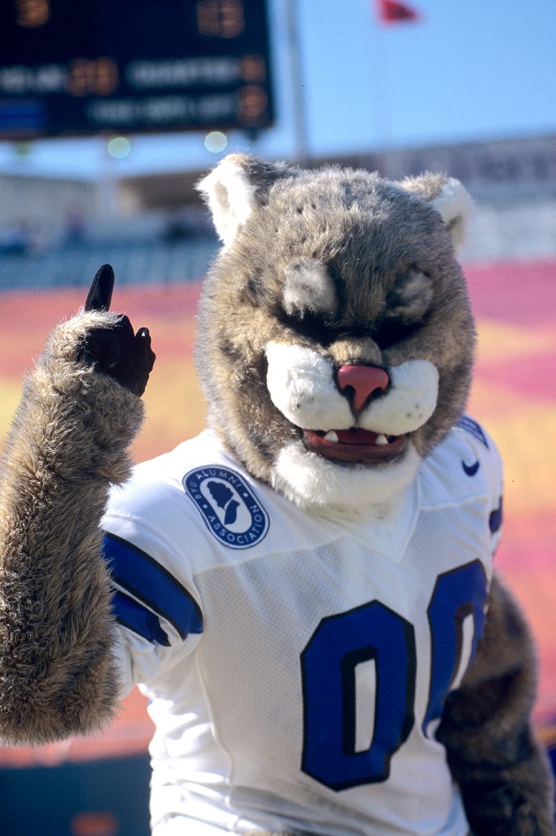 Cosmo cheers at a BYU v. Southern Methodist University football game in 1997.