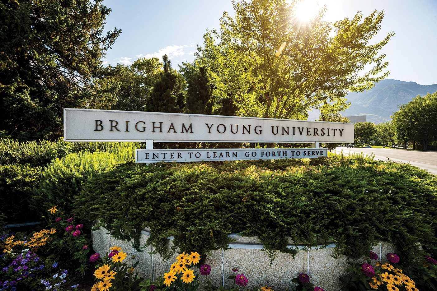 BYU entrance sign with the motto "Enter to the Learn; Go Forth to Serve."