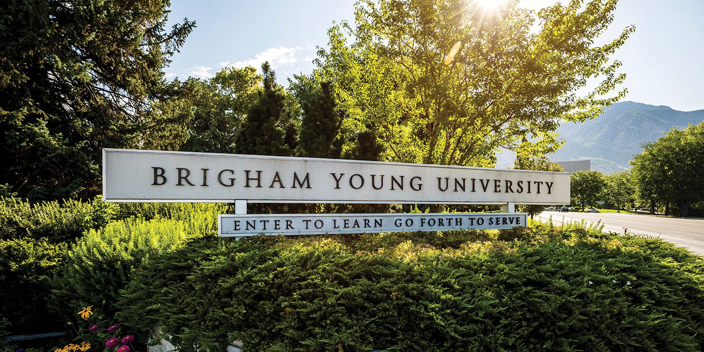 BYU entrance sign with the motto "Enter to the Learn; Go Forth to Serve."