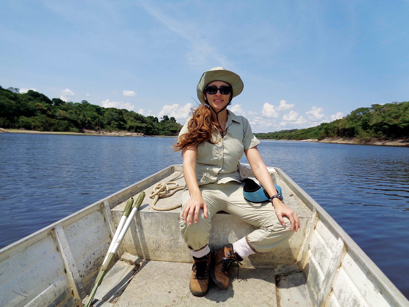 Reptile and amphibian researcher Fernanda Werneck on a boat in the Amazon.