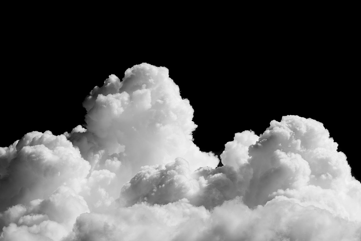 Close-up of cumulus clouds isolated on a black sky background