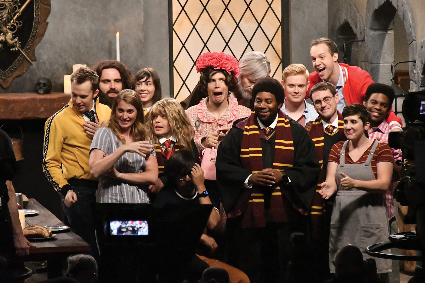 The original ten members of the Studio C cast are grouped together in a candid photo with Kenan Thompson.