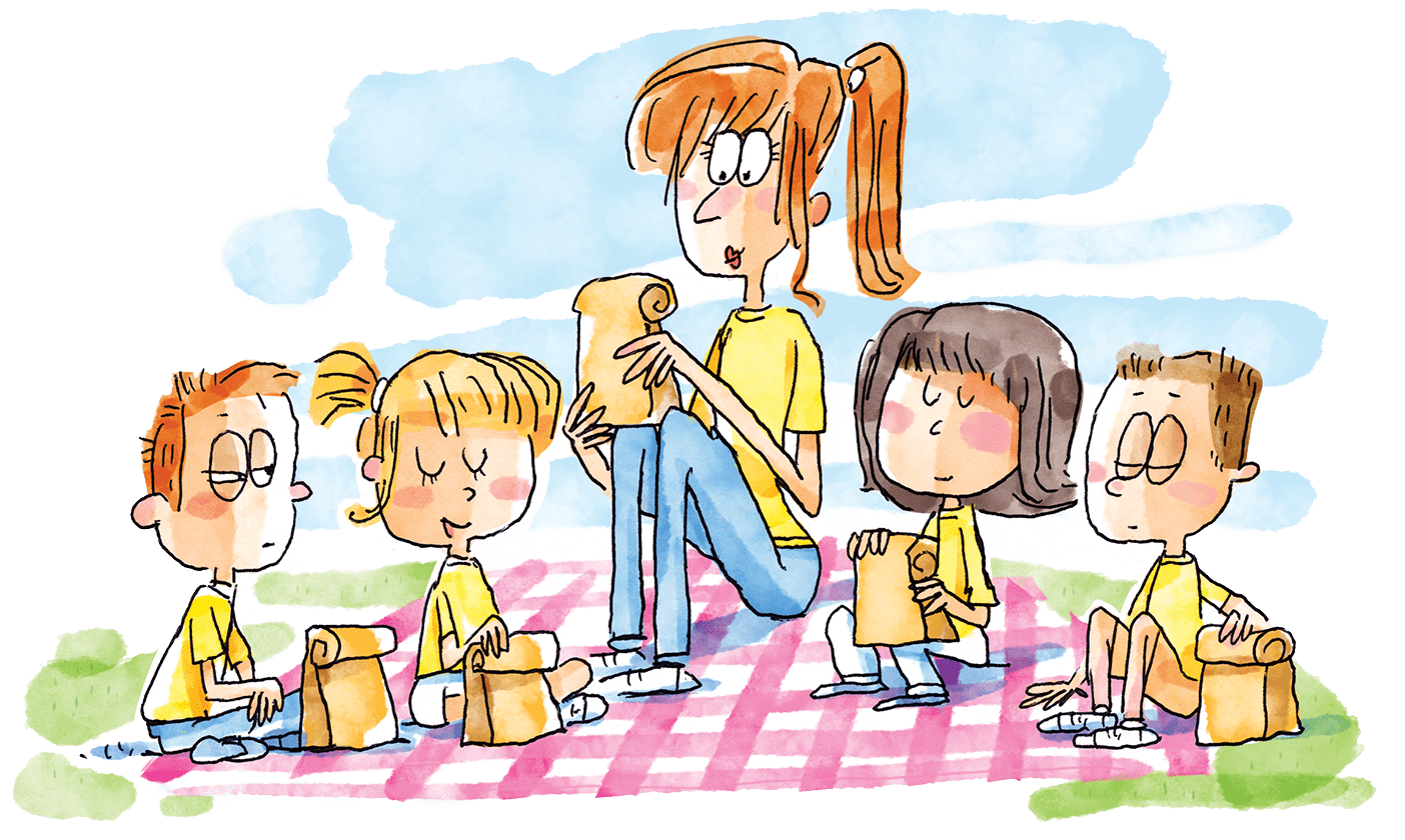 A group of children pray before eating a picnic lunch.