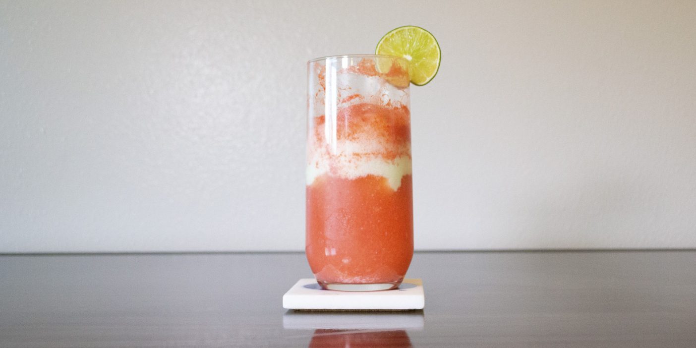 A picture of the George Randal Freeze, a slushy red, lime drink