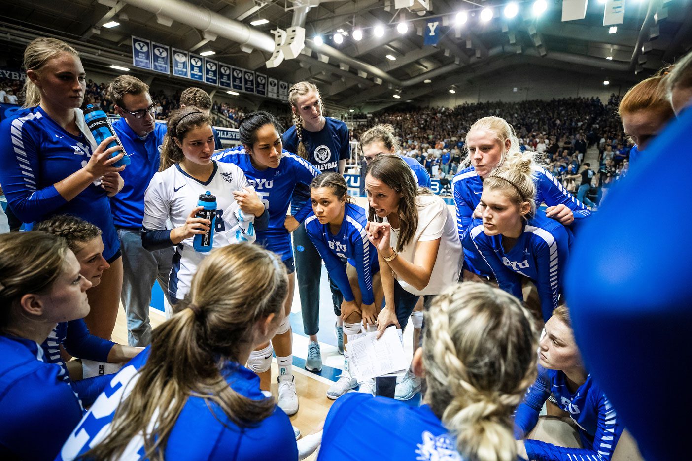 2018 BYU Women's Volleyball Team huddles during a game with Utah