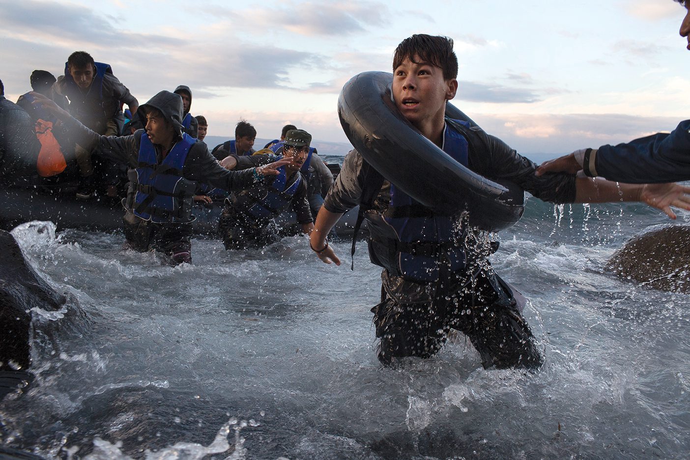 After battling rough seas and high winds on the crossing from Turkey, migrants arrive on the northern shore of Lesbos Island in Greece.